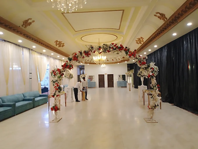 Bridal stage with chandelier and royal chairs